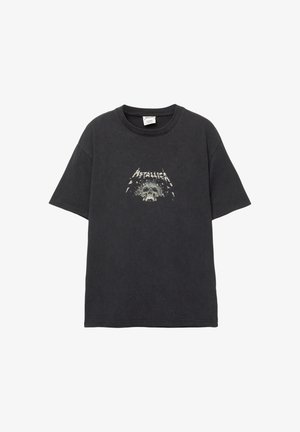Schwarzes Baumwoll-T-Shirt mit kurzen Ärmeln und Rundhalsausschnitt. Mit einem zentralen Grafikdesign eines Schädels und dem Text "Metallica" darüber.