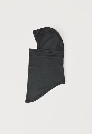 Cagoule noire avec capuche et protection de cou allongée, posée à plat sur un fond clair.