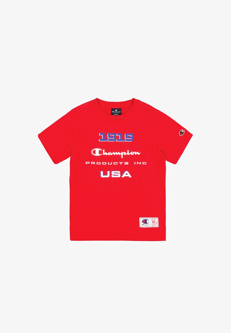 Camiseta corta roja de algodón, con texto azul y blanco: "1919 Champion Products Inc USA". Logo en la manga izquierda, etiqueta en el dobladillo.