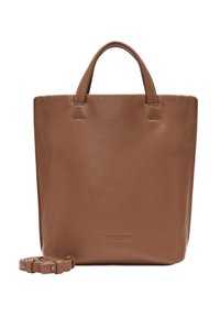 Torebka typu tote w kolorze tan, z dwoma krótkimi uchwytami i odpinanym paskiem na ramię. Gładka tekstura, minimalistyczny design, z subtelnym logo u dołu.