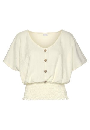 Cream short-sleeve textured blouse with deep V-neck, four brown buttons down the front, and smocked elastic waistband with ruffled hem.