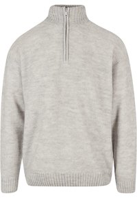Lys grå strikket pullover sweater med en halvlange lynlås-krave. Har et struktureret stof, ribbet nederkant og en løs pasform for komfort.