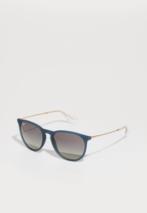 Blue sunglasses with gradient lenses, a matte finish, and thin metallic arms. Accented with clear plastic tips for comfort.