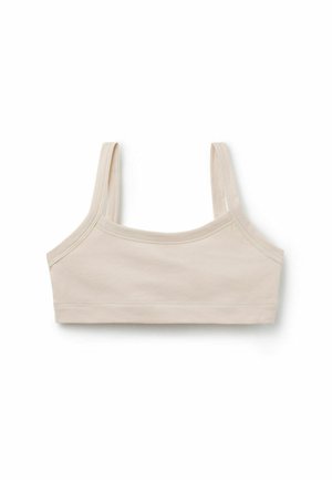 Top corto color beige con sottili spalline e cuciture semplici, mostrato su sfondo bianco.