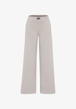 Pantaloni sportivi larghi grigi chiari realizzati in tessuto morbido, con vita elastica e design minimalista senza motivi o accenti visibili.