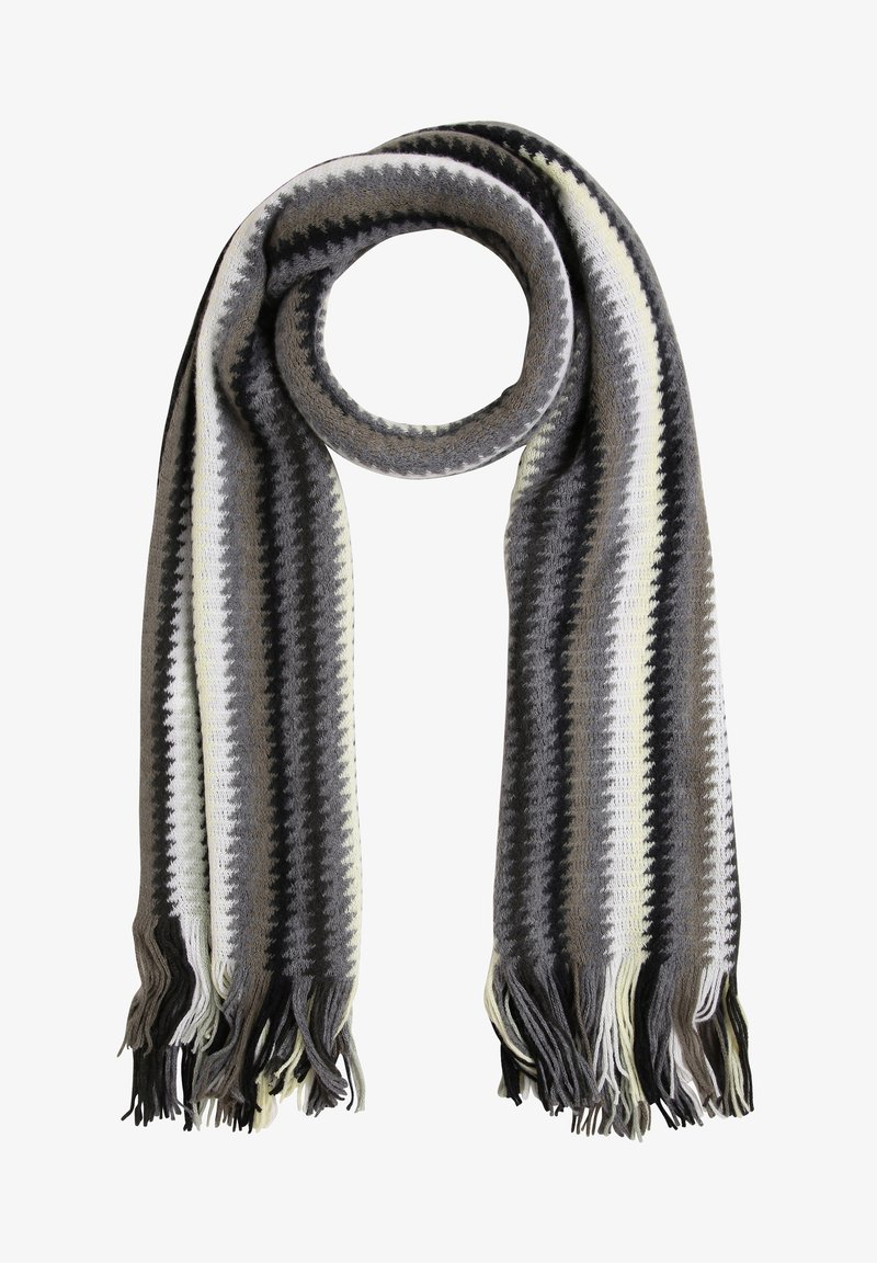 Écharpe en tricot avec des rayures en zigzag noir, blanc, gris et beige, aux extrémités frangées, présentée en boucle circulaire sur fond blanc.