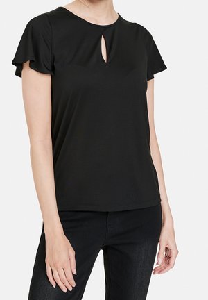 Top negro de manga corta con escote redondo y detalle de ojo de cerradura. Hecho de tela suave con una textura lisa. Diseño sencillo y ajustado.