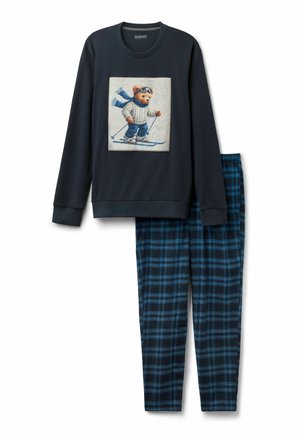 Dvoudílná souprava pyžama obsahující tmavě modrou mikinu s grafikou medvěda na lyžích a odpovídající kárované černomodré pyžamové kalhoty.