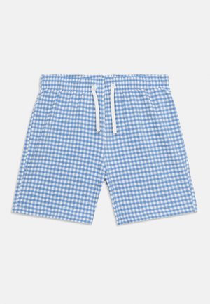 Short à carreaux bleu et blanc avec taille élastique et cordon blanc sur un fond uni.