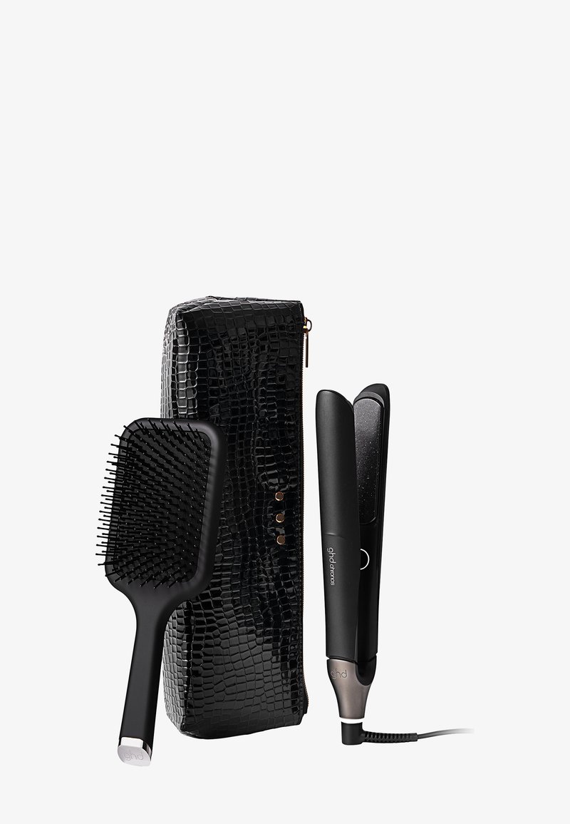 Hårstrykare, svart krokodilmönstrad förvaringslåda, paddleborste, elegant design, texturerat material, silverdetaljer, glänsande yta.