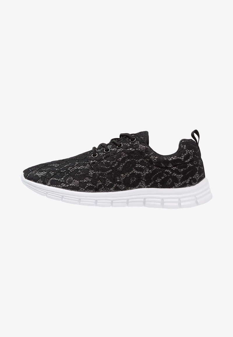 Black lace sneakers with a textured pattern, featuring a lightweight white sole, flat laces, and a heel pull tab for easy wear.