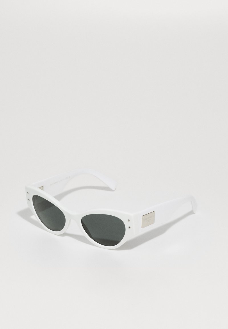 White sunglasses with a cat-eye shape, dark grey lenses, and metal accents on the temples, featuring a smooth matte finish.