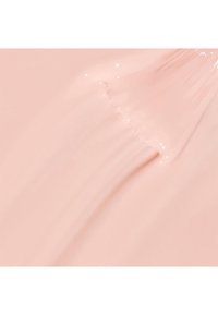Tessuto rosa, morbido, con una finitura lucida e una leggera lucentezza. Linee testurizzate creano onde delicate, enfatizzando il colore chiaro.
