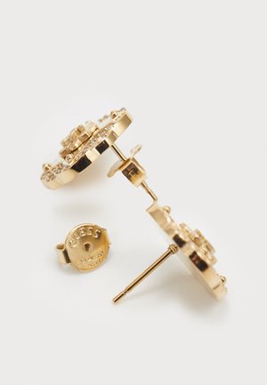 Gold earrings with a round design, featuring a textured surface and gemstone accents. Includes a branded back closure.