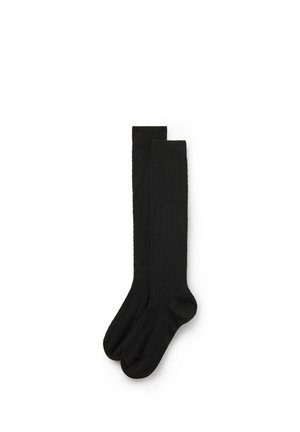 Calcetines negros hasta la rodilla con un patrón texturizado y puño superior acanalado. Fabricados con una tela suave, presentan un acabado liso y un diseño estándar en la punta.