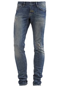 Blue denim jeans with a slim fit, featuring distressed details and light fading. Standard waistband with five-pocket design and zipper fly.