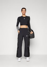 adidas Sportswear CARGO PANT - Hlače - black