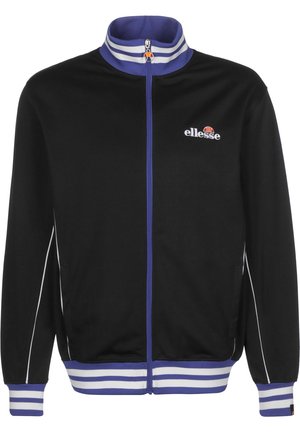 Veste de sport noire zippée avec col, poignets et bas rayés violet et blanc, avec le logo ellesse sur la poitrine gauche.