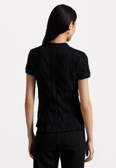 Black knitted short-sleeve polo shirt featuring a textured cable pattern on the back and a flat collar, paired with black pants.