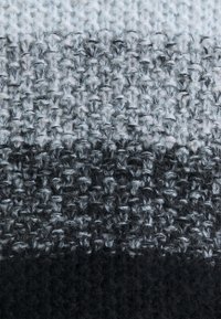 Woven fabric featuring an ombre gradient from light gray to dark gray, with a textured finish and soft, fuzzy fibers throughout.
