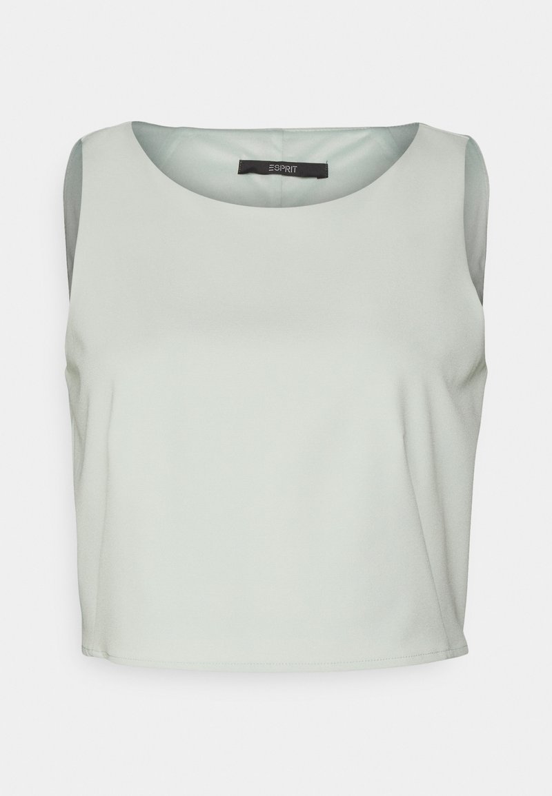 Haut sans manches vert clair en tissu lisse, avec un col rond et un design simple, sans ornements.
