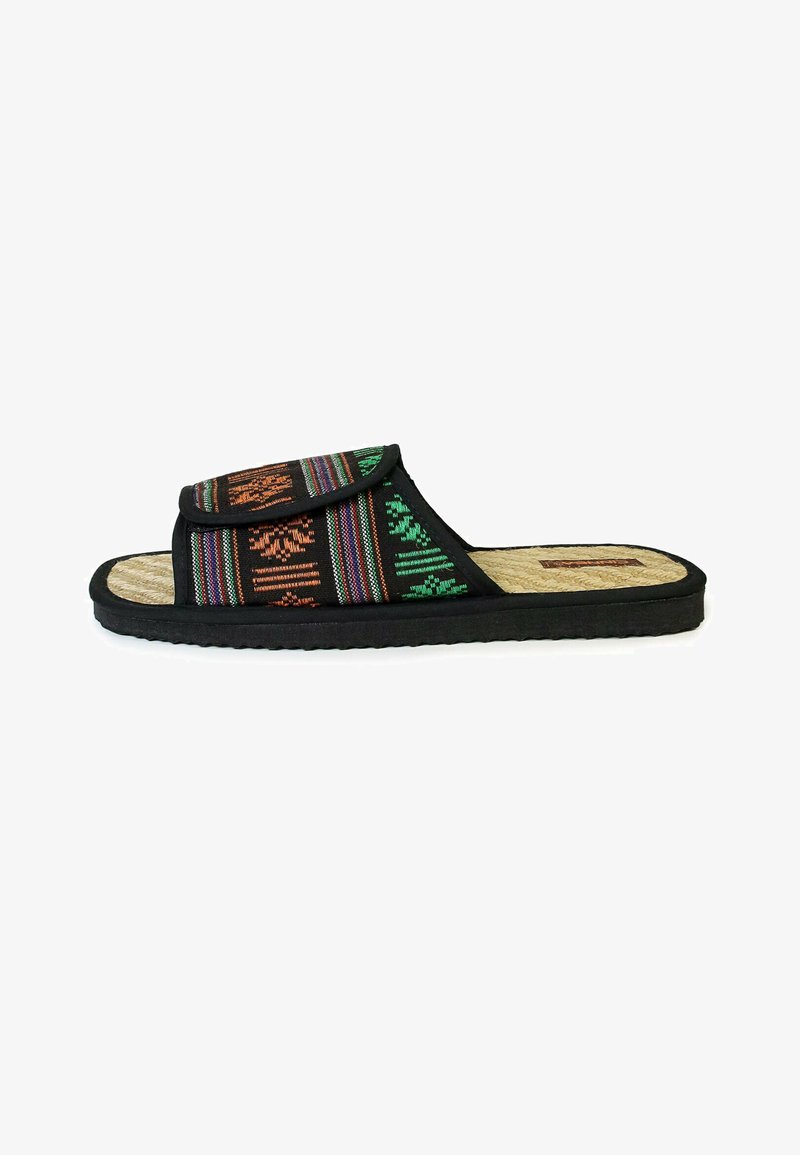 Black slide sandal with woven fabric strap featuring colorful geometric patterns. Textured sole for grip, natural fiber insole.