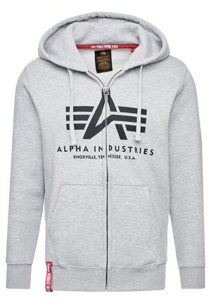 Grå zip-up hoodie i mjukt material, med en stor svart logotypdesign och två framfickor. Dragband på huvan och ribbade ärmslut.