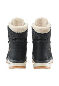 Schwarze, fellgefütterte Stiefel mit einem strukturierten grauen Obermaterial, weichem beige Kragen und langlebiger Gummisohle. Mit metallischen Akzenten und seitlichen Schlaufen.