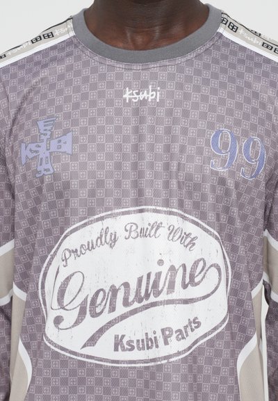 Grey patterned long-sleeve shirt featuring a central "Genuine Ksubi Parts" logo, the number 99, and an embroidered Ksubi emblem.
