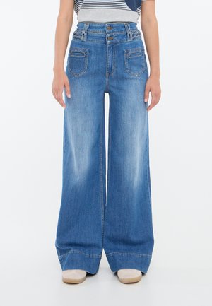 Wide-leg denim pants in light blue, featuring two front pockets, a high waistband with button closures, and a smooth texture with slight fading.