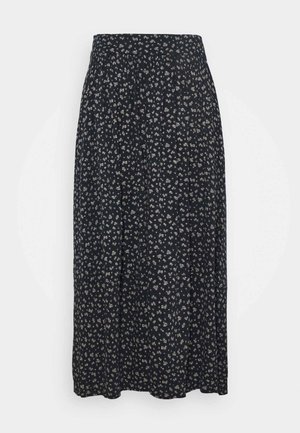 Schwarzer plissierter Midirock mit kleinem weißen Blumenmuster und figurbetontem Bund, vor weißem Hintergrund präsentiert.