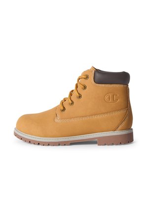 Stivaletto color cuoio con lacci, collo imbottito marrone scuro, suola in gomma con battistrada e logo impresso sul lato.