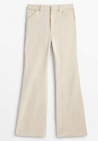 Pantalon en velours côtelé beige avec poches avant, passants pour ceinture, braguette zippée et coupe évasée à jambes larges.