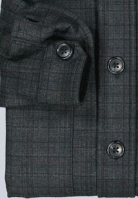 Gray plaid blazer featuring a textured fabric, rounded corners, and black buttons. Details include a subtle brown grid pattern.