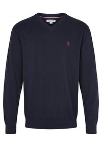 Marinblå V-halströja i glatt stickat tyg. Har ribbade ärmslut och nederkant, med en liten röd logotyp på bröstet.