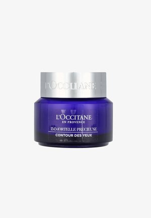 Lila Glasaugencreme-Glas mit silbernem Metalldeckel, beschriftet mit "L'Occitane Immortelle Précieuse Contour des Yeux" in weißem Text.