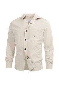 Beige skjorte med knapper laget av bomull, med lange ermer, en enkelt brystlomme og svarte knapper med en subtil logoaccent.