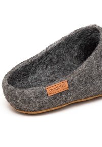 Gray felt slipper with a brown leather tag, featuring a rounded shape, soft texture, and a textured inner lining for comfort.