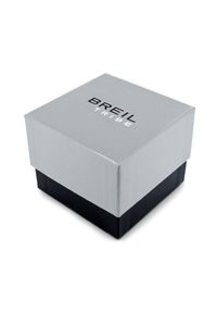 Boîte cadeau carrée en papier, avec un dessus gris et une base noire. Le couvercle affiche le nom de la marque "BREIL TRIBE" en lettres noires en gras.