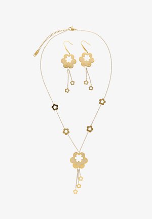 Naszyjnik i pasujące kolczyki w złotym odcieniu z motywem kwiatów, z wyciętymi płatkami i wiszącymi kwiatowymi zawieszkami na cienkich łańcuszkach.