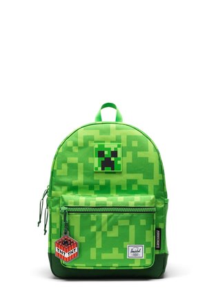 Sac à dos vert vif sur le thème Minecraft Creeper avec motif pixélisé, écusson visage Creeper, porte-clés TNT, poche avant zippée et poignée supérieure.
