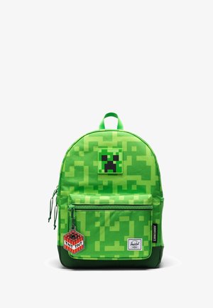 Jaskrawozielony plecak z motywem Minecraft Creeper, z pikselowym wzorem, naszywką z twarzą Creepera, brelokiem TNT, przednią kieszenią na zamek i górnym uchwytem.