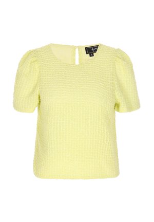 Žlutý texturovaný top s krátkými balonovými rukávy, čtvercovým výstřihem a detailem na zádech v podobě klíčové dírky. Vyrobeno z tkaniny s křížovým vzorem.