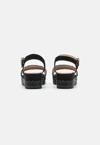 Unisa Sandali con plateau - black