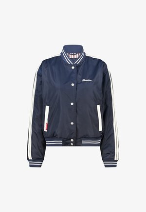 Cazadora bomber azul marino hecha de tela suave con detalles de rayas blancas. Cuenta con botones a presión, puños acanalados y bolsillos laterales.