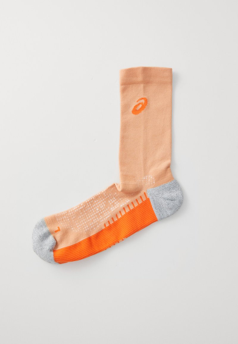 Peach cotton sock with gray toe and heel, orange accents, and textured pattern. Features branding logo on the side.