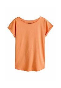 T-shirt couleur pêche en coton doux, avec un large décolleté, des manches courtes et une coupe décontractée sans motifs ni détails visibles.