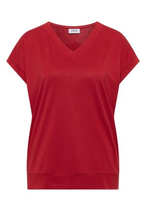 Haut rouge pour femme à manches courtes, col en V et poignets repliés, fabriqué en tissu lisse, avec l’étiquette « CECIL » à l’intérieur de l’encolure.
