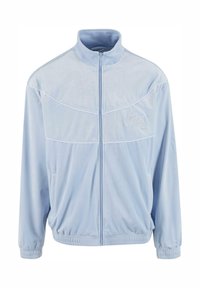 Hellblauer Fleece-Trainingsjacke mit hohem Kragen, durchgehendem Reißverschluss, elastischen Bündchen und Saum; mit weißen Paspeln und Logo-Stickerei.