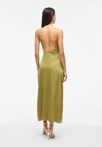 Olive green satin midi dress with a low back and thin straps, featuring a smooth texture and a straight silhouette.